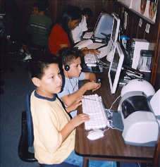 Children learning at computers